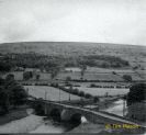 Grinton Bridge photographed from the Church tower. The barn by the river has been converted to a cottage.