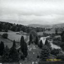 The West end of the church graveyard also showing the Harkerside road and Mergill cottage.